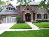 Brick house with wood doors