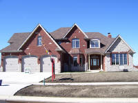 large house with wood entry door