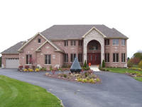 house with large entry and wood door