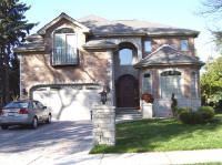 house with wood arched front door