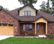 wood garage door with sunburst pattern
